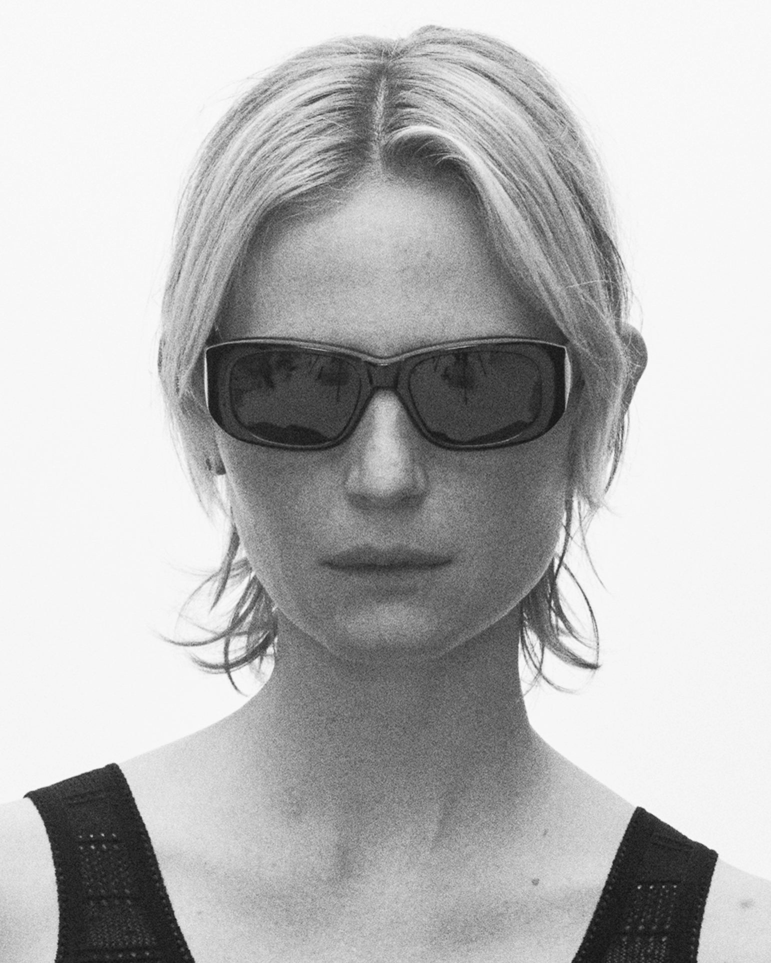 model wearing sunglasses, facing forward