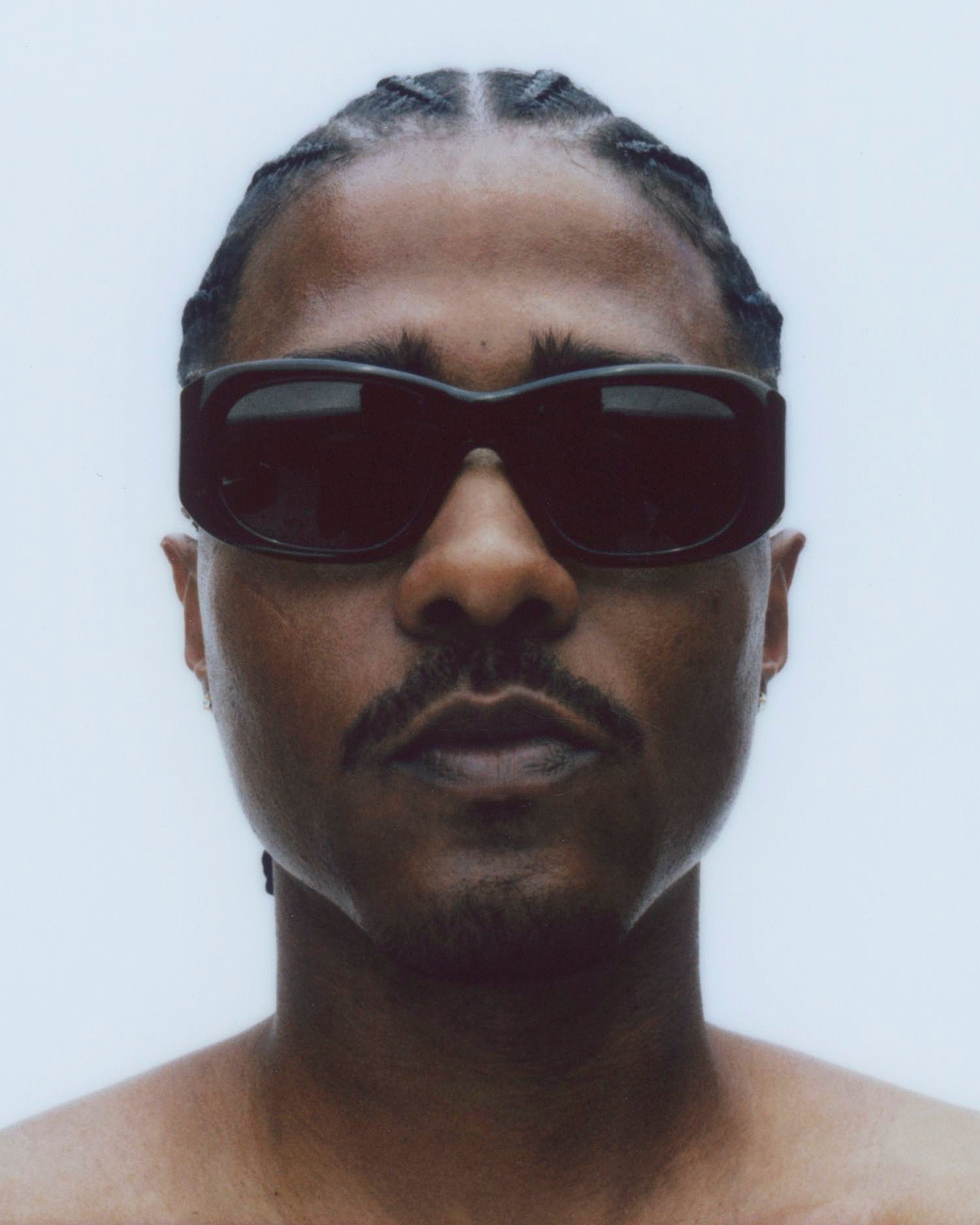 model wearing sunglasses, facing forward