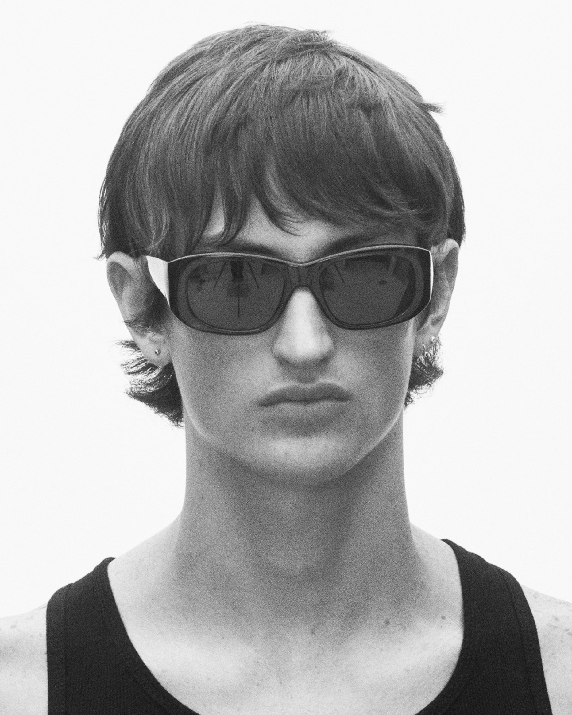 model wearing sunglasses, facing forward