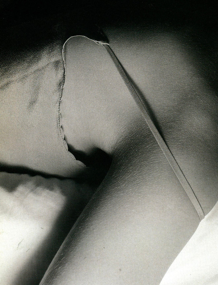 closeup of a shirt strap falling off a woman's shoulder